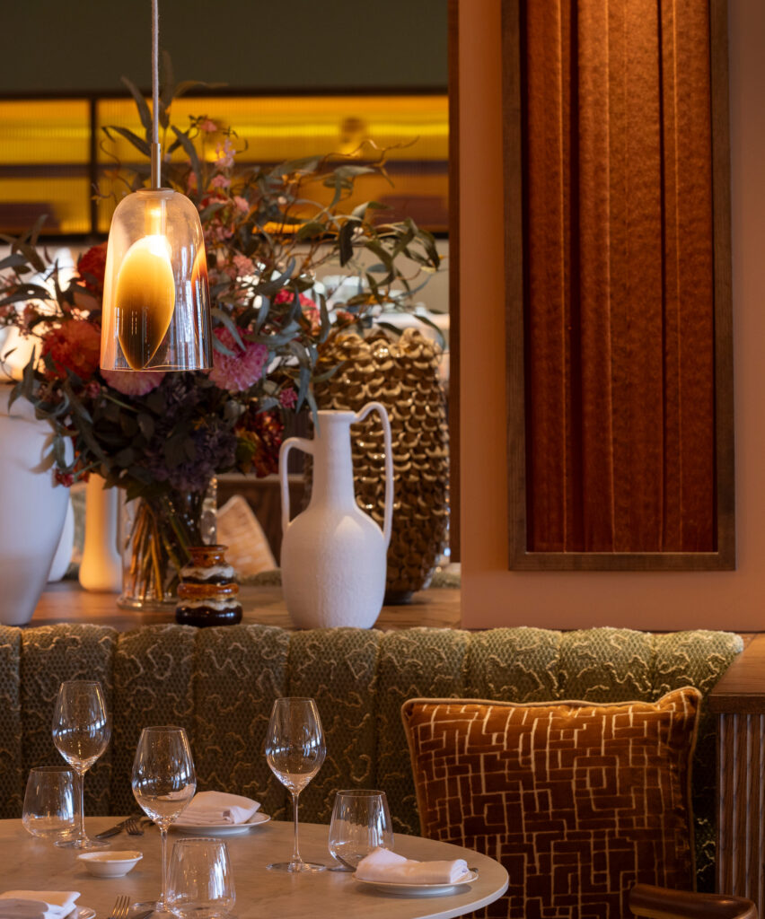 Commercial hospitality lighting design in London UK, integrating decorative and architectural lighting for contemporary restaurant interiors.