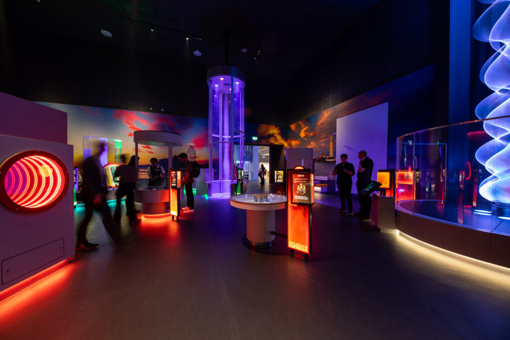 Science centre lighting design enhancing visitor engagement through interactive exhibits focused on motion, energy and perception.