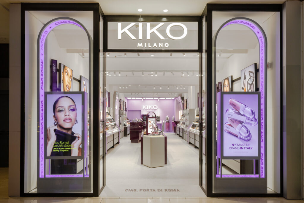 Retail lighting design for KIKO Milano's beauty store in Rome, Italy, combining layered illumination with premium cosmetic product displays.